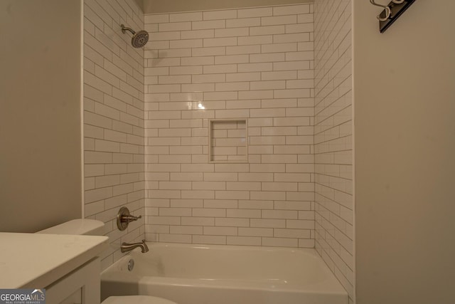 bathroom featuring shower / tub combination, vanity, and toilet