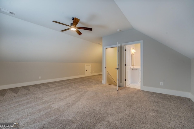 bonus room with ceiling fan, visible vents, baseboards, vaulted ceiling, and carpet