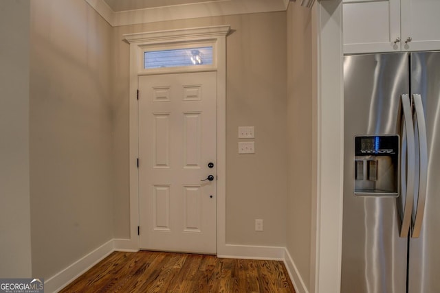 entryway featuring baseboards and dark wood-type flooring