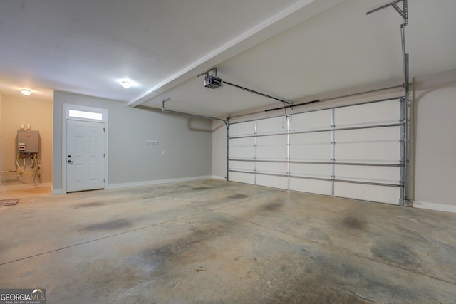 garage with baseboards, tankless water heater, and a garage door opener