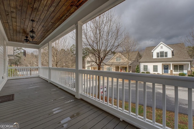 wooden deck featuring a residential view