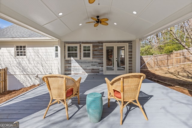 deck featuring ceiling fan, fence, and french doors