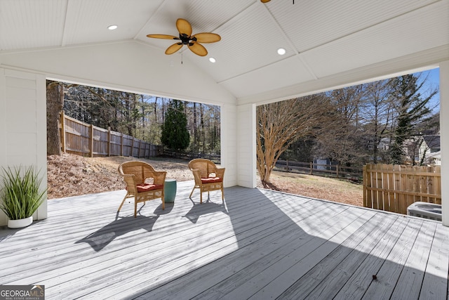 deck featuring a fenced backyard and a ceiling fan