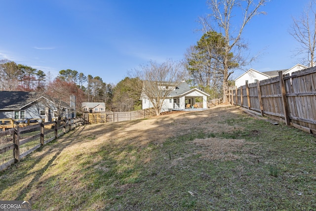 view of yard with a fenced backyard