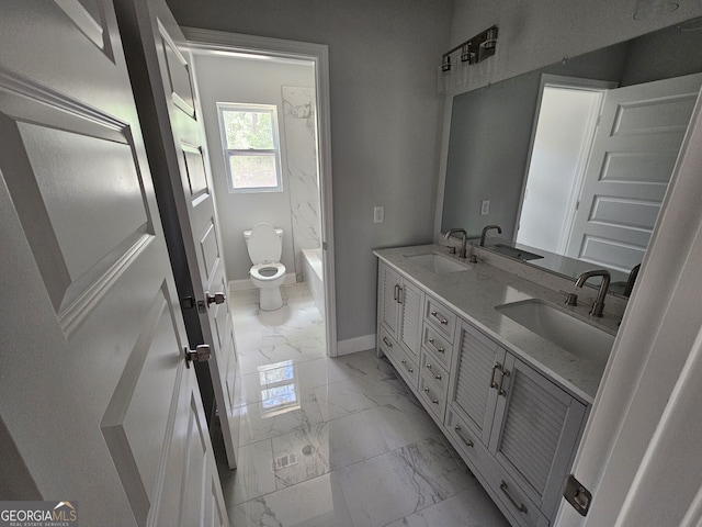 bathroom featuring marble finish floor, baseboards, and a sink