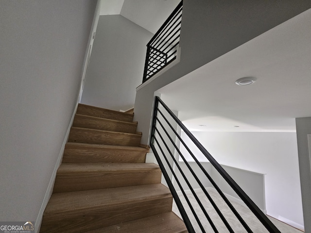 stairs featuring baseboards