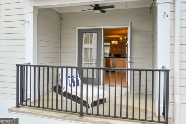 doorway to property with ceiling fan