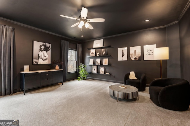 living area featuring light carpet, ceiling fan, and crown molding