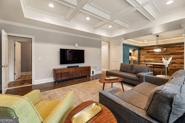 living area featuring recessed lighting, coffered ceiling, wood finished floors, and decorative columns