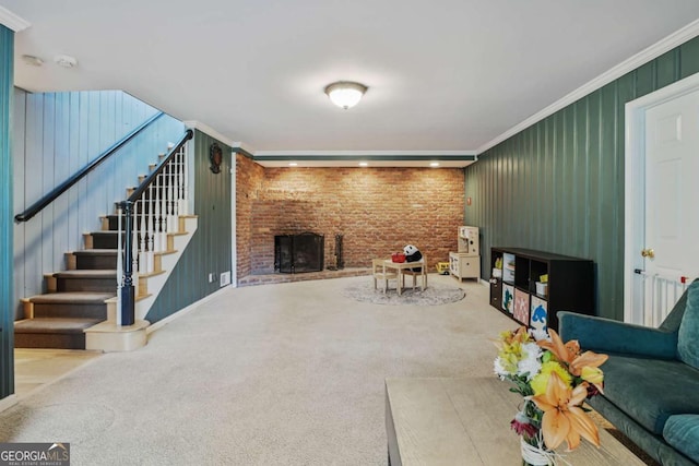 carpeted living area featuring stairs, brick wall, ornamental molding, and a brick fireplace