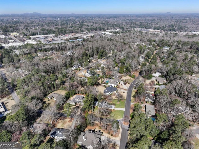 bird's eye view with a forest view