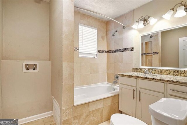 bathroom featuring a textured ceiling, tile patterned flooring, toilet, tiled shower / bath combo, and vanity