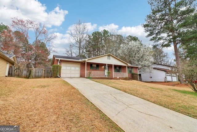 ranch-style home with a porch, a garage, brick siding, concrete driveway, and a front yard