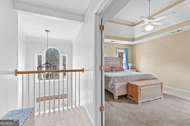 corridor featuring baseboards, visible vents, ornamental molding, carpet floors, and a notable chandelier