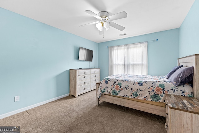 carpeted bedroom featuring visible vents, ceiling fan, and baseboards