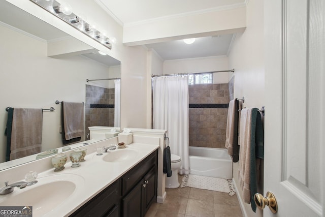 full bathroom with toilet, ornamental molding, a sink, and tile patterned floors