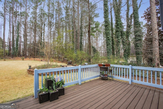 deck featuring a lawn