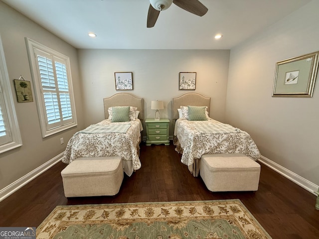 bedroom with a ceiling fan, baseboards, and wood finished floors