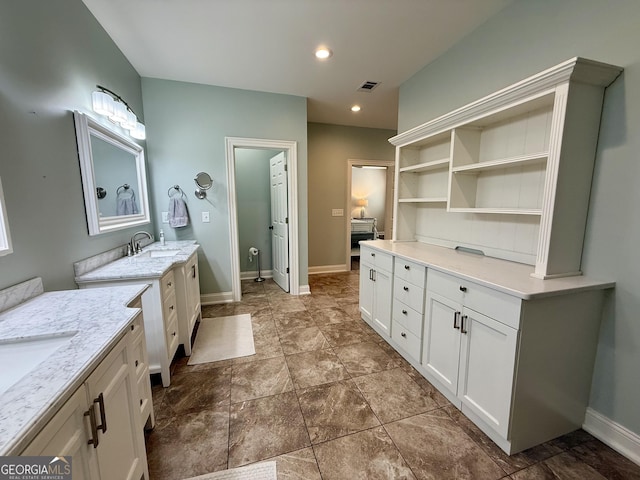 full bathroom with baseboards, visible vents, a sink, two vanities, and recessed lighting