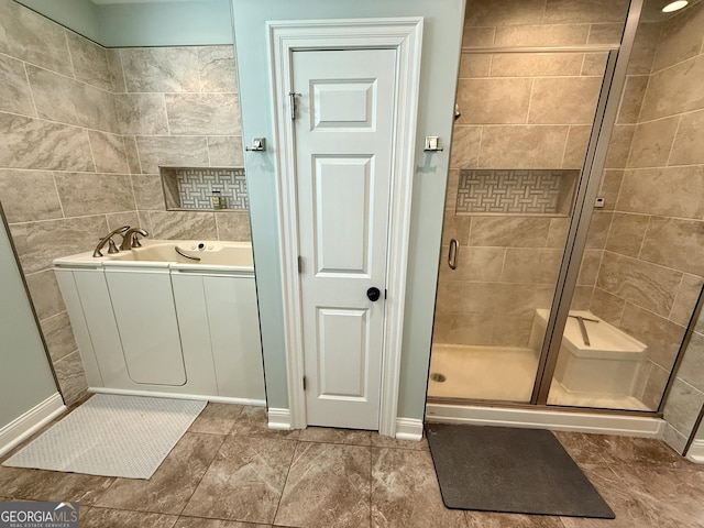 bathroom featuring a garden tub and a shower stall