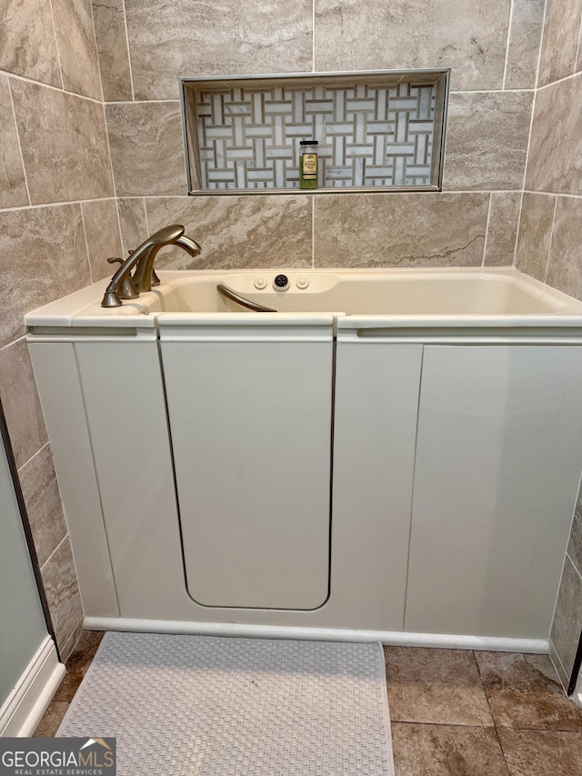 full bathroom with a washtub