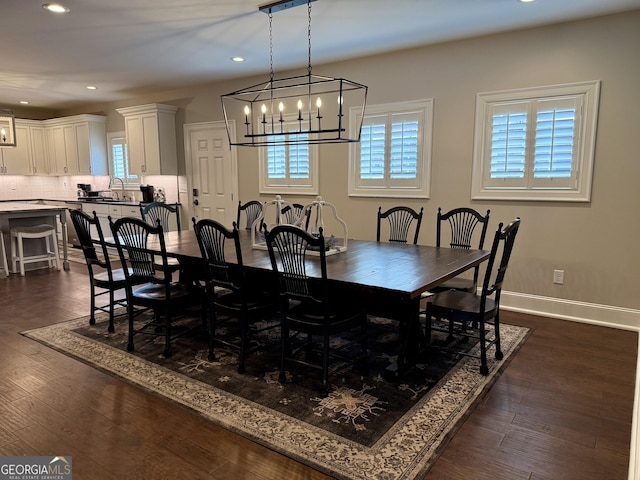 dining space with plenty of natural light, baseboards, dark wood-type flooring, and recessed lighting