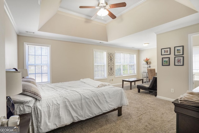 bedroom featuring carpet, a tray ceiling, crown molding, visible vents, and baseboards