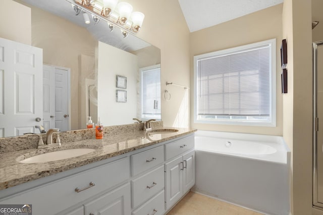 bathroom with a bath, double vanity, a shower, and a sink