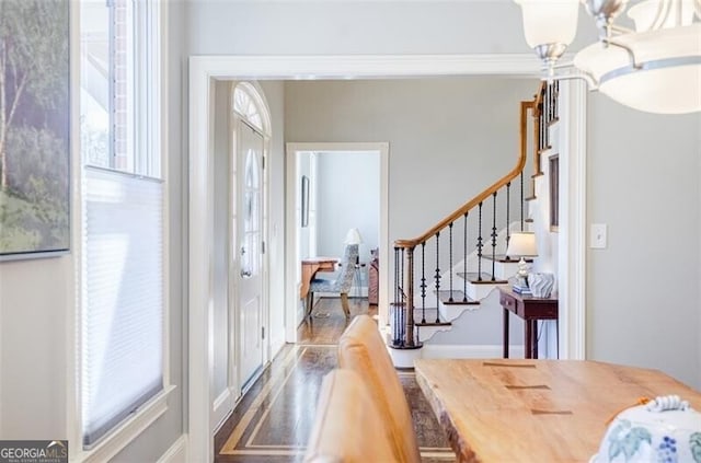 entryway with stairway and wood finished floors