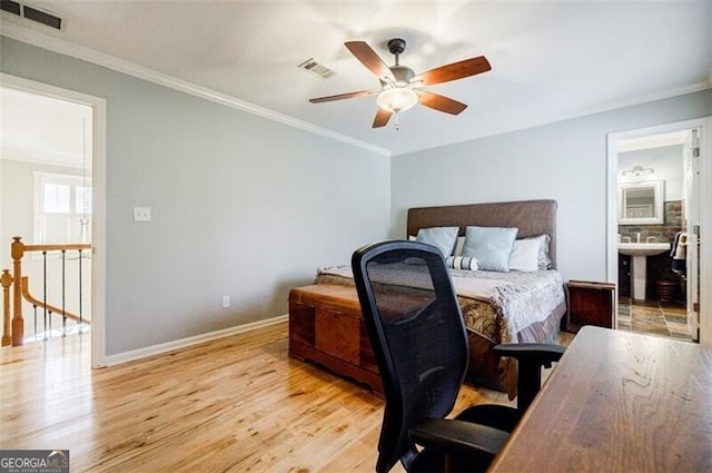 bedroom with light wood-type flooring, baseboards, visible vents, and crown molding