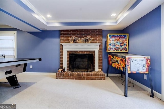 rec room featuring a raised ceiling, recessed lighting, and baseboards