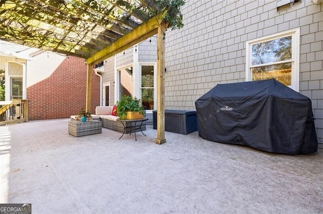 view of patio / terrace with grilling area, an outdoor hangout area, and a pergola