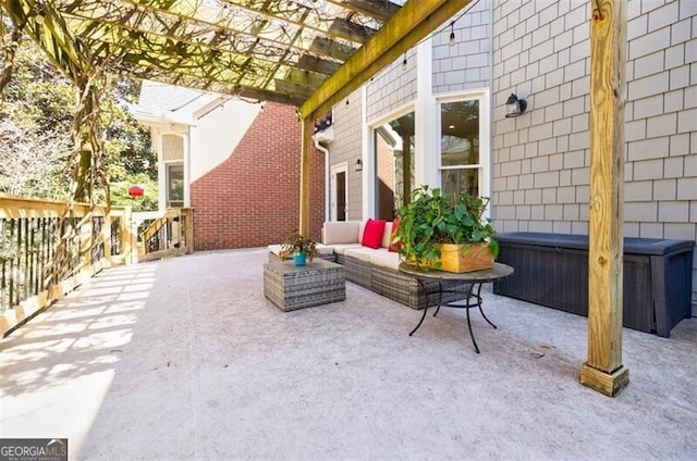 view of patio with an outdoor hangout area and a pergola