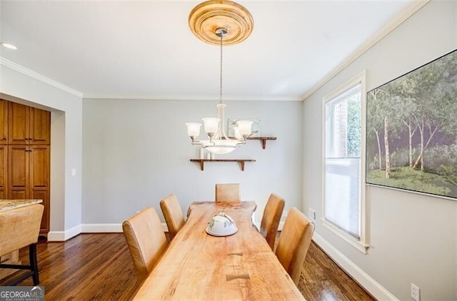 dining space featuring ornamental molding, baseboards, dark wood-style flooring, and a chandelier