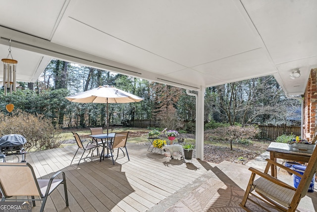 deck with fence and outdoor dining area