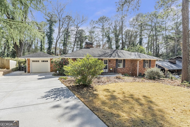 single story home with a garage, brick siding, fence, driveway, and a chimney