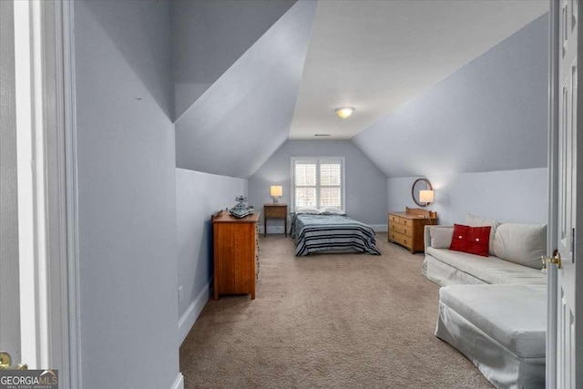 bedroom featuring lofted ceiling, carpet, and baseboards