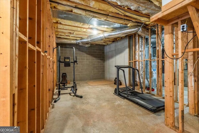 exercise room with concrete block wall