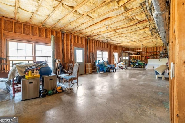 miscellaneous room with a garage and concrete flooring