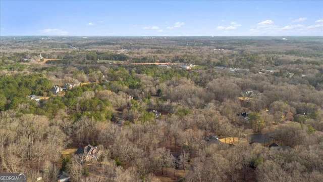 birds eye view of property with a forest view