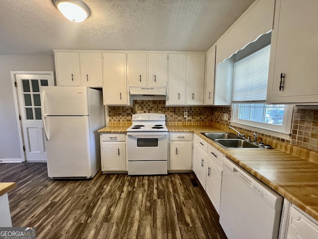 kitchen with white cabinetry, white appliances, dark wood-style floors, and under cabinet range hood