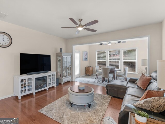 608 Larch Looper Dr, Griffin, GA 30223 - living area with ceiling fan, visible vents, baseboards, and wood finished floors