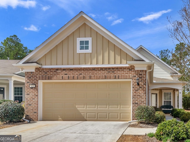 608 Larch Looper Dr, Griffin, GA 30223 - view of front of property featuring brick siding, board and batten siding, an attached garage, and concrete driveway