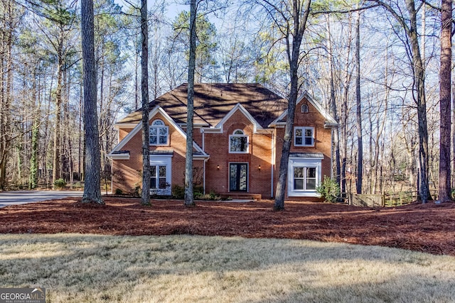 view of front of house featuring brick siding