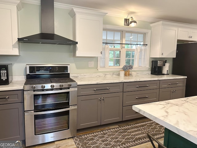 746 Thomas Rd, Trion, GA 30753 - kitchen featuring wall chimney exhaust hood, stainless steel appliances, gray cabinetry, ornamental molding, and white cabinets