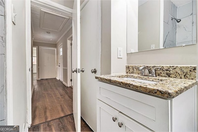 bathroom with vanity and wood finished floors