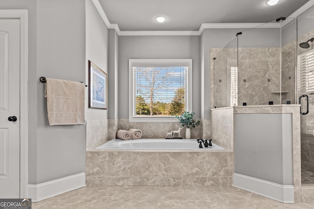 full bathroom with a stall shower, a bath, and crown molding