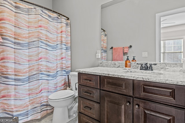 full bathroom with vanity and toilet