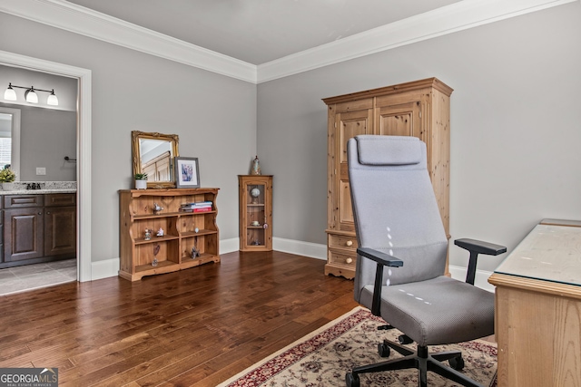 office area with crown molding, baseboards, and wood finished floors