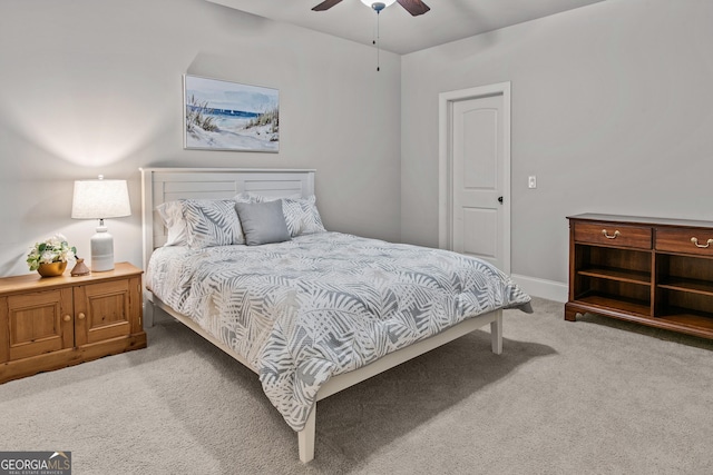 bedroom with a ceiling fan, carpet, and baseboards